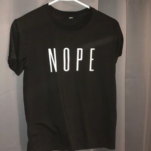 Black “NOPE” t-shirt.